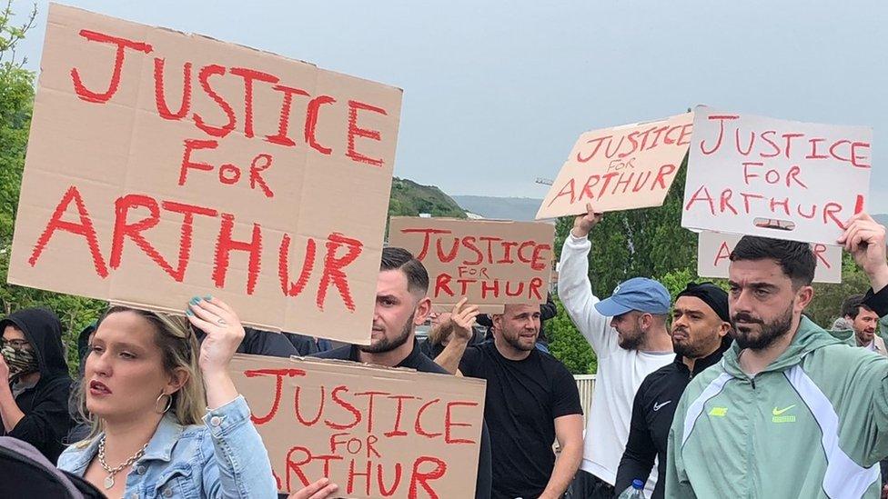 Protesters carrying banners