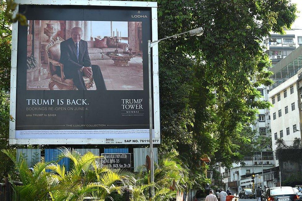 A billboard for the upcoming luxury residential apartment complex Trump Tower Mumbai, which bears the name of billionaire real estate tycoon and US presidential hopeful Donald Trump, is seen next to a busy road in Mumbai on June 3, 2016