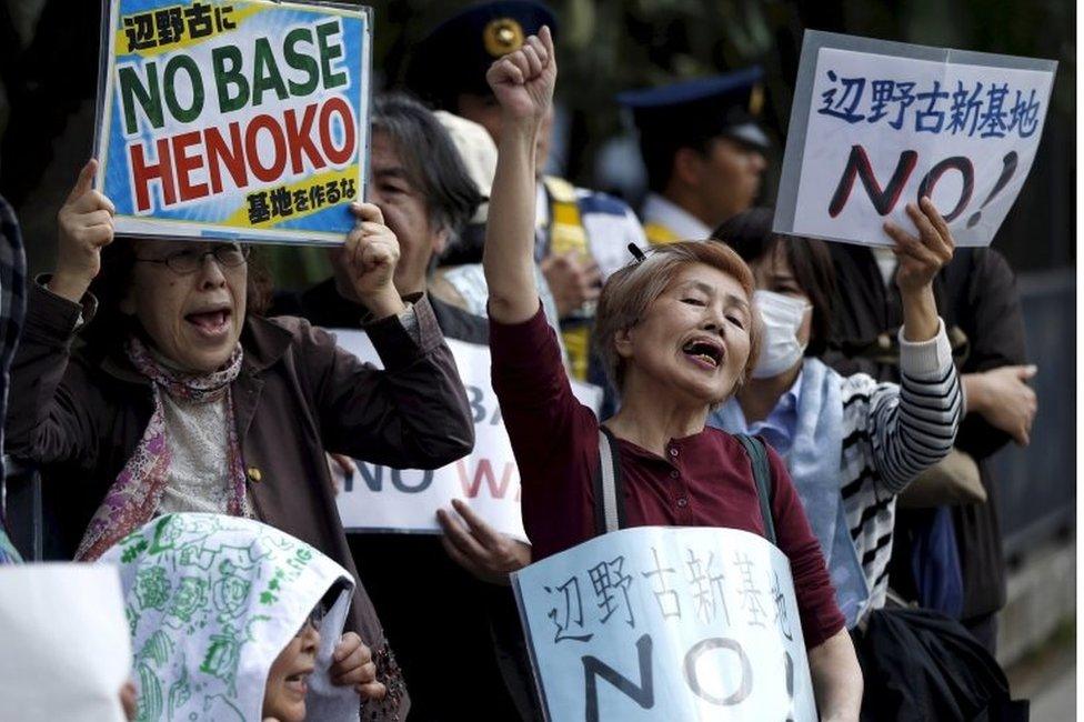 People protesting the planned relocation of the US military base to Okinawa's Henoko coast, at a rally in front of Prime Minister Shinzo Abe's official residence on 14 March