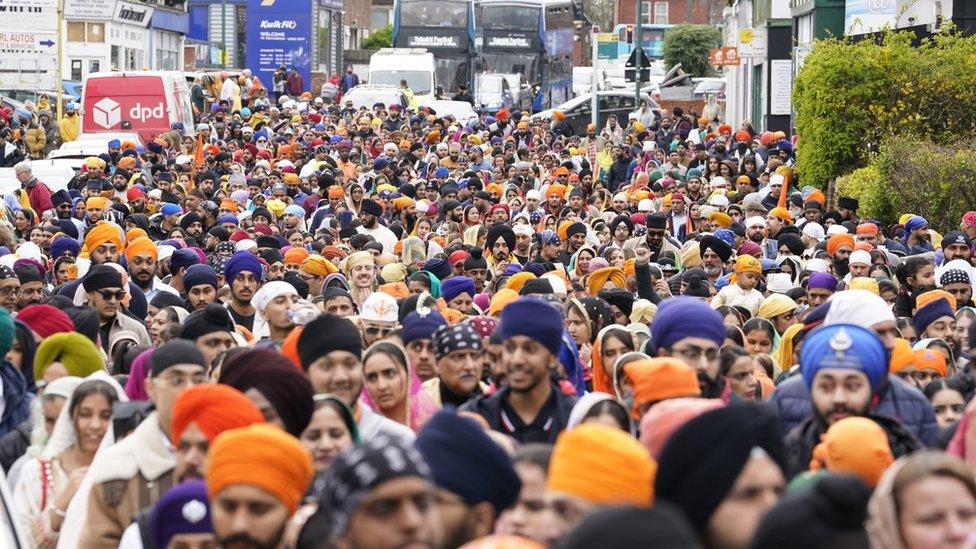 People take part in the Nagar Kirtan procession through the city centre in Southampton