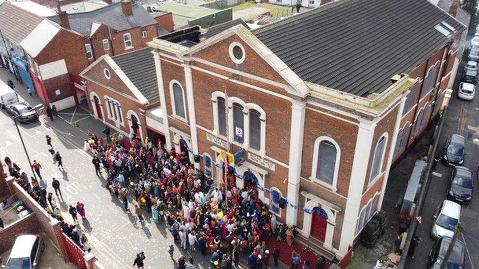 Devotees outside the temple