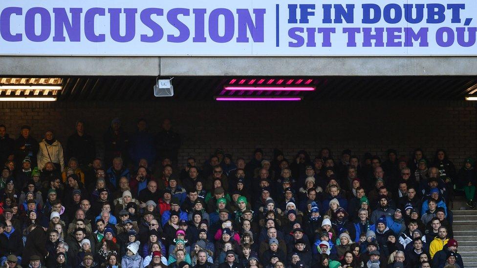 Fans watching rugby