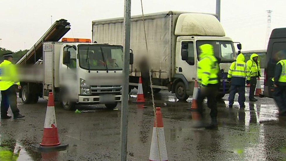 Police inspecting vehicles