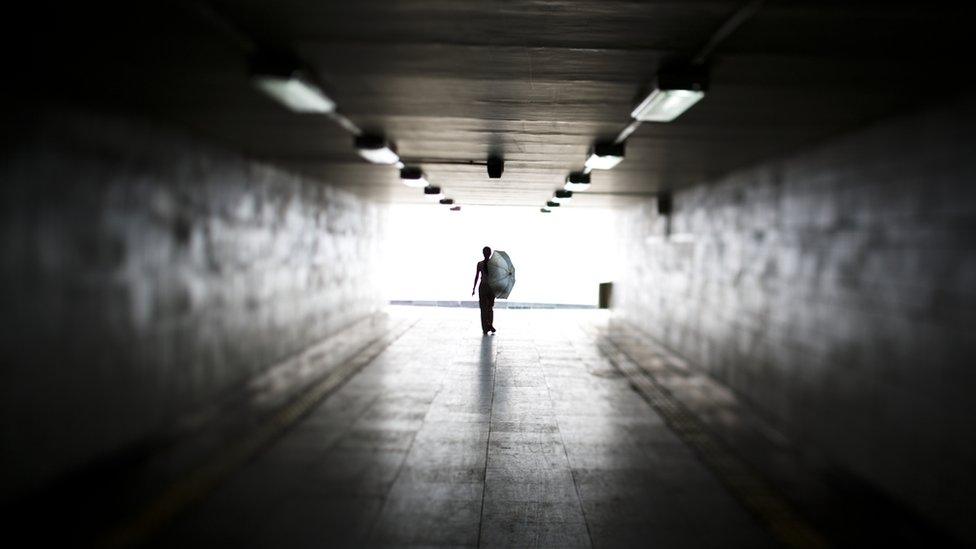 Woman in underpass