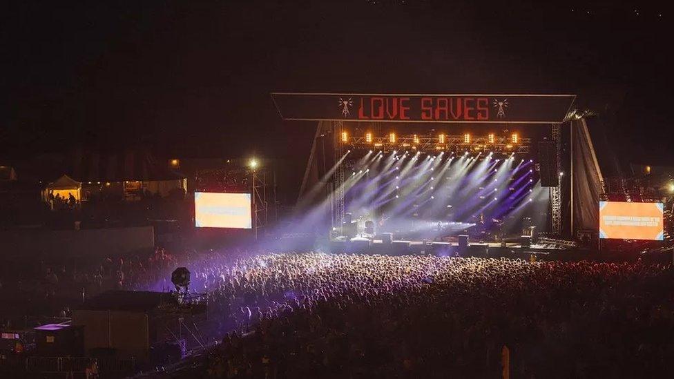 Crowds in front of Love Saves the Day's main stage at night