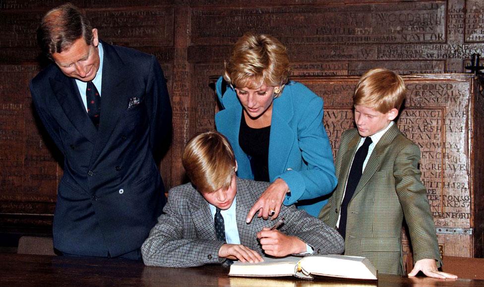 Prince Charles, Princess Diana and Prince Harry watch Prince William sign the Eton College entrance book in September 1995