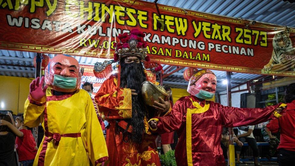 Cai Shen Ye, the God of Fortune, walks around the Kapasan Chinese village in Surabaya, Indonesia