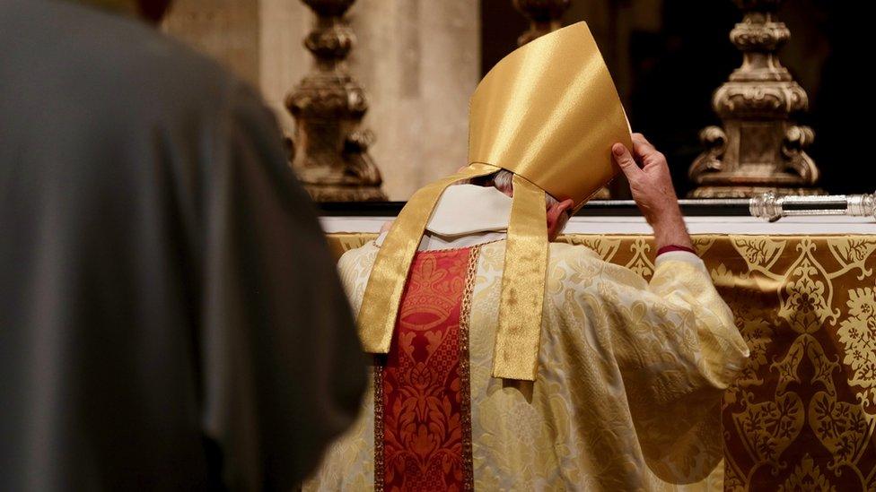 The Archbishop laying down his pastoral staff