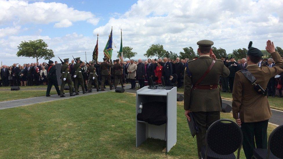 Irish and British soldiers parade together at commemoration .