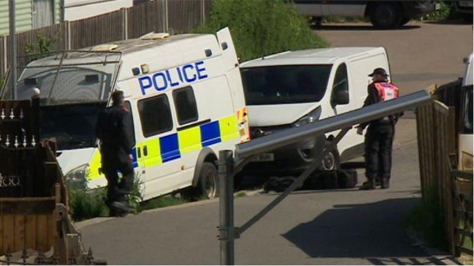 Police vans at Abingdon Road