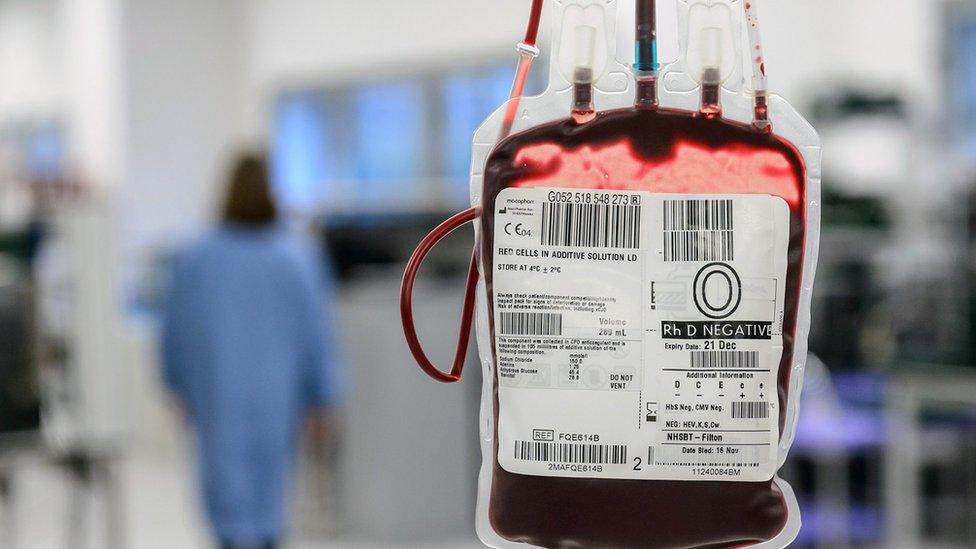 File photo of a suspended O negative blood bag in front of a NHs hospital corridor.