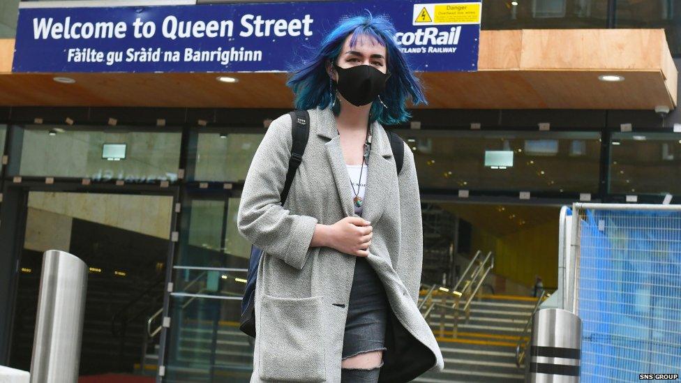 Customer with a mask at Queen Street train station