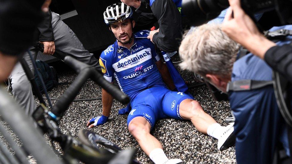 Julian Alaphilippe reacts after crossing the finish line