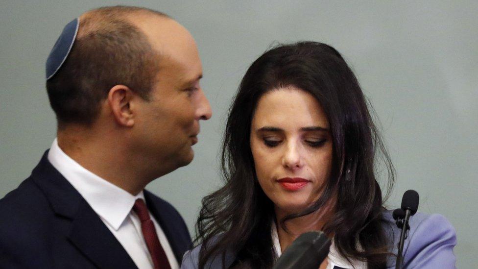 Israeli Education Minister Naftali Bennett (L) and Justice Minister Ayelet Shaked (R) are seen together as they give a statement at the Knesset in Jerusalem on 19 November 2018.