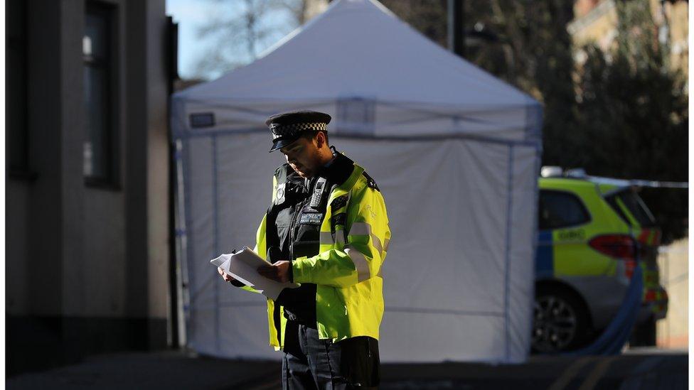 Picture of policeman on Link Street, Camden, where a 20-year-old man was stabbed in April