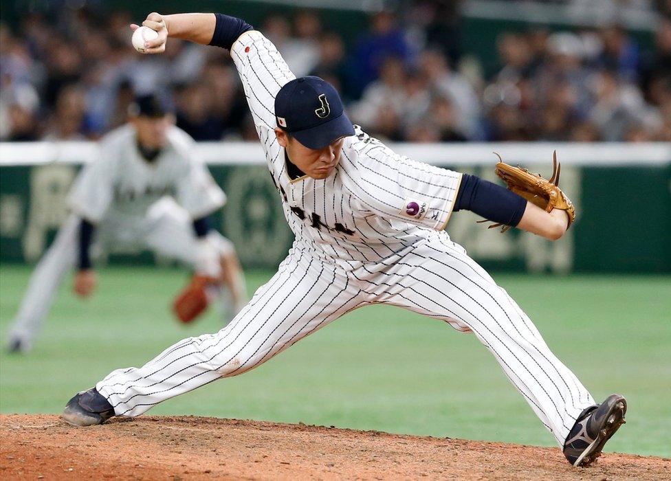 Japan's closer Kazuhisa Makita pitches against Israel during the ninth inning of their second round game of the World Baseball Classic at Tokyo Dome in Tokyo. 15 March 2017.