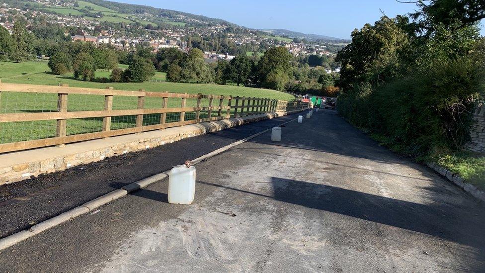 A wooden fence lining a road