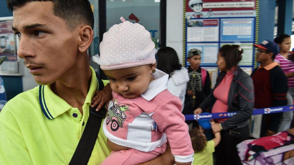 Venezuelan nationals queue at the binational border attention centre (CEBAF) in Tumbes, northern Peru in the border with Ecuador on August 24, 2018