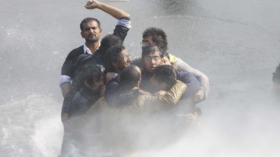 Police use water cannon and tear gas to control demonstrators during a protest at Vijay Chowk, following a brutal gang rape of 23 year Para medical student in a moving bus, on December 22, 2012 in New Delhi, India.