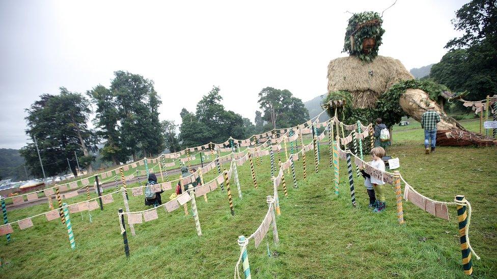 The giant green man watches over the festival