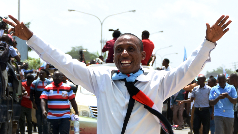 A Chadema party supporters cheers as he welcomes Tanzanian opposition stalwart Tundu Lissu (not seen) upon his return after about five years in exile in Dar es Salaam, Tanzania -25 January 2023