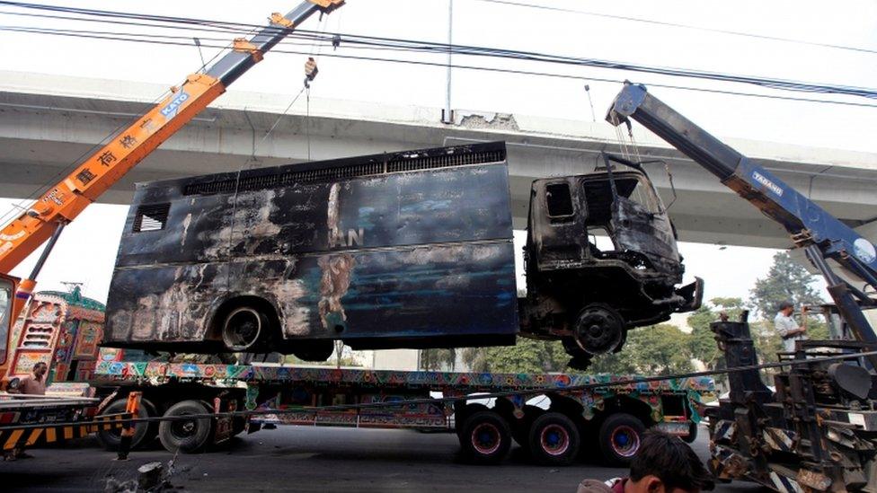 Destroyed police vehicle in Islamabad