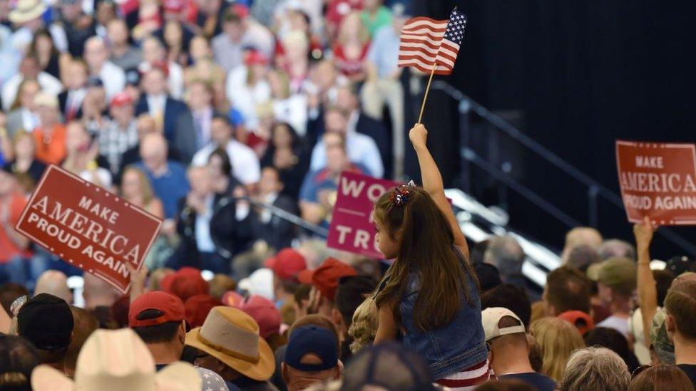 Supporters cheer as US President Donald Trump speaks at a Make America Great Again rally in Phoenix, Arizona