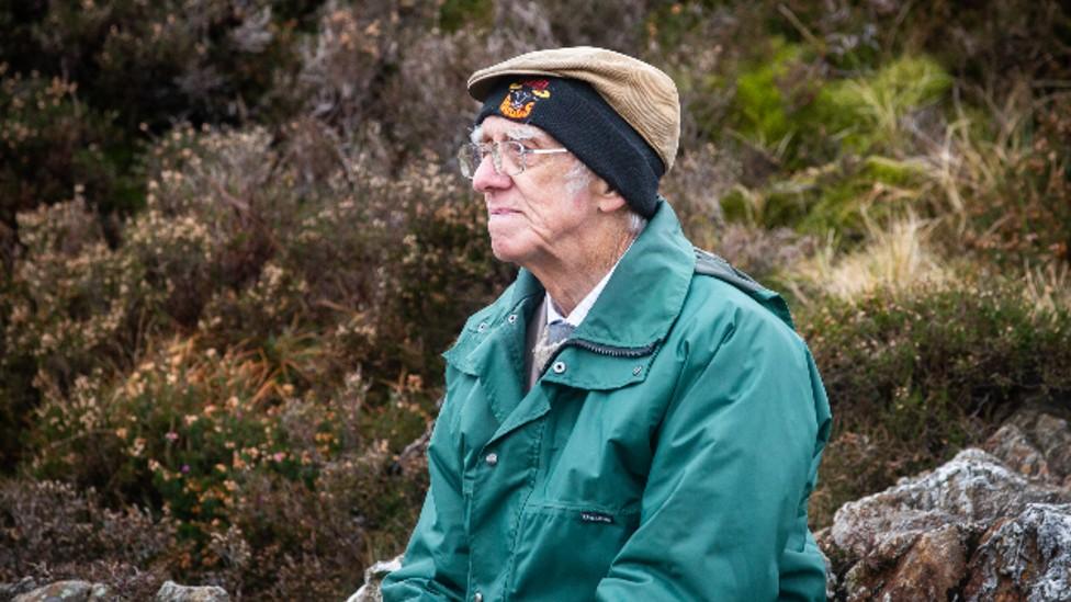 Andrew Nichol sitting by Innominate Tarn