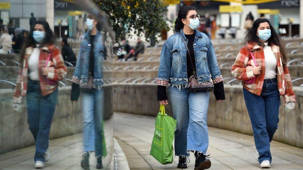 People wearing masks in Manchester city centre