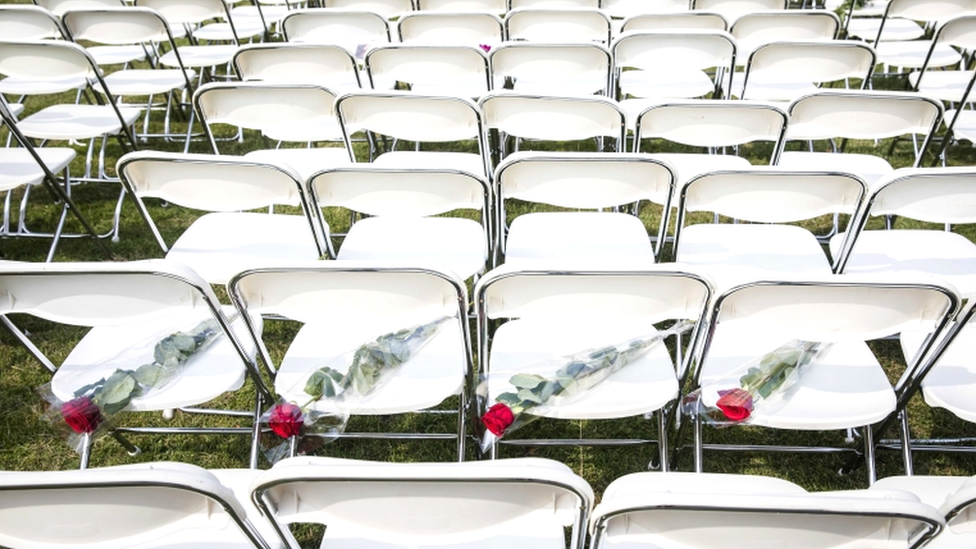 White chairs and red roses are set up by relatives of crash victims of flight MH17 as a silent protest in front of the Russian embassy in The Hague, The Netherlands, 8 May 2018