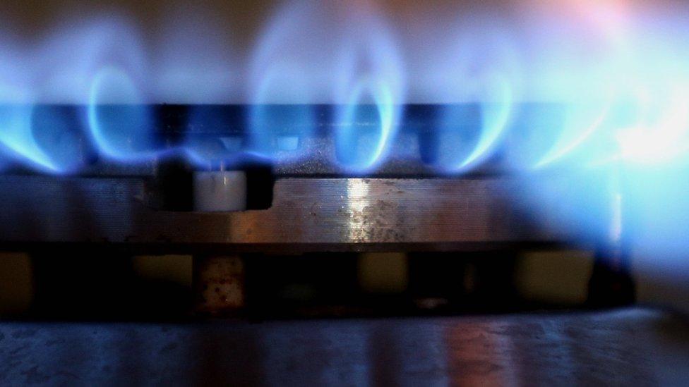 Blue flames on a gas stove