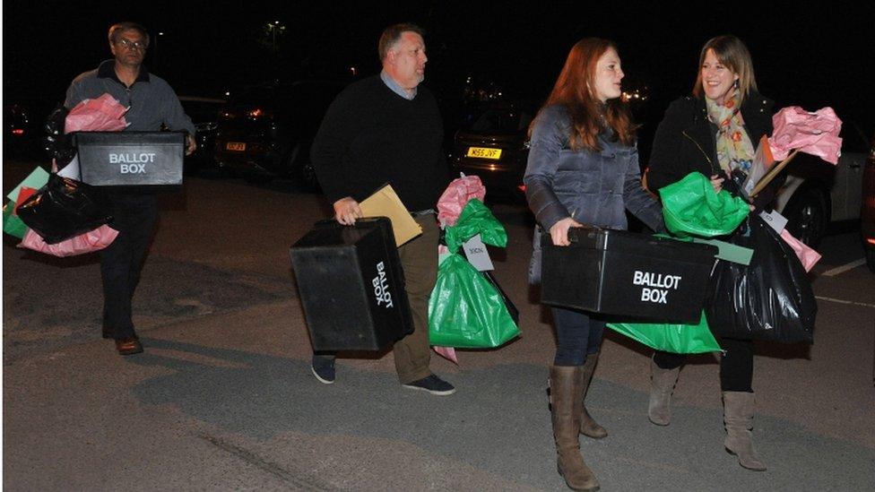 Election staff in Essex with ballot papers ahead of counting