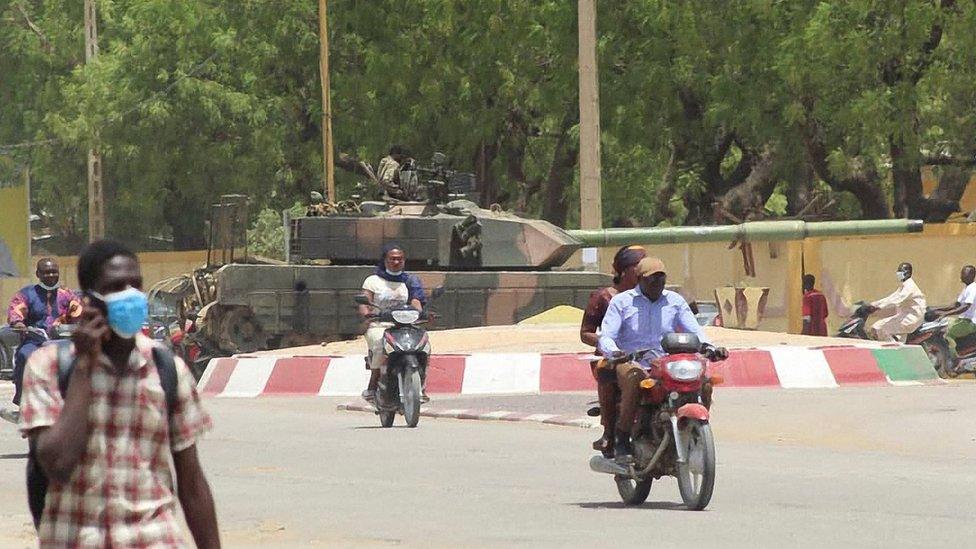 A Russian made T-55 tank in seen stationed at a roundabout in the city of N'Djamena, Chad, on April 19, 2021