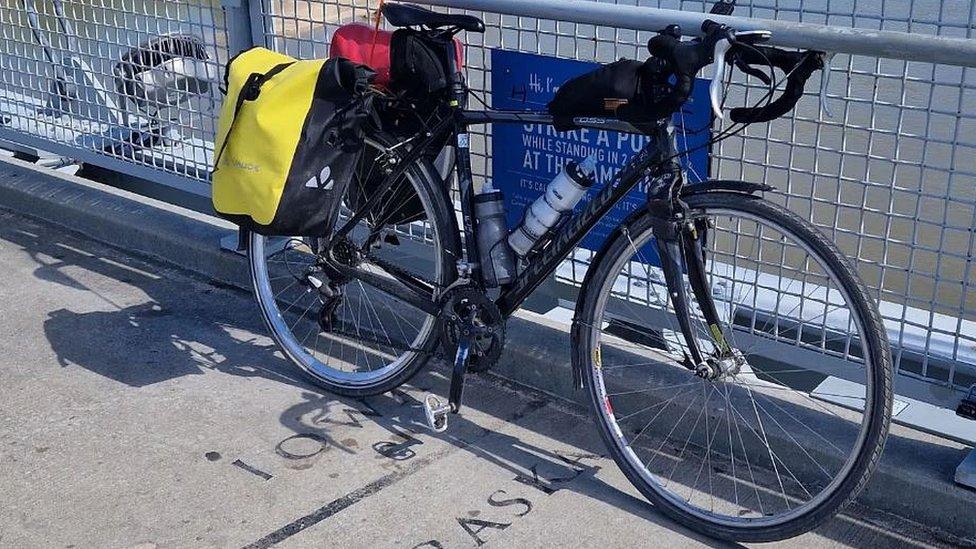 Antony Butcher's bike on a bridge half way between