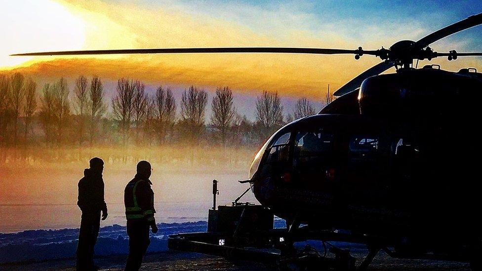 Wales Air Ambulance and crew at sunrise