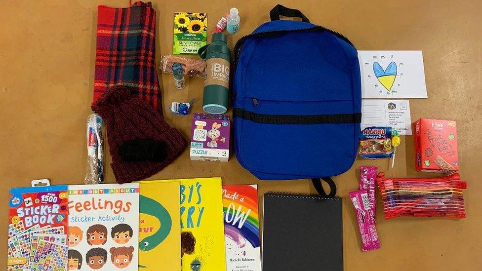 A backpack with books, a hat and food set to be sent to Ukrainian refugee children