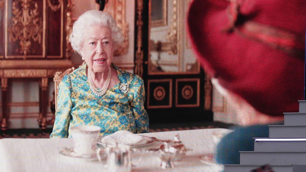 The Queen and Paddington Bear on a big screen at the Platinum Party at the Palace