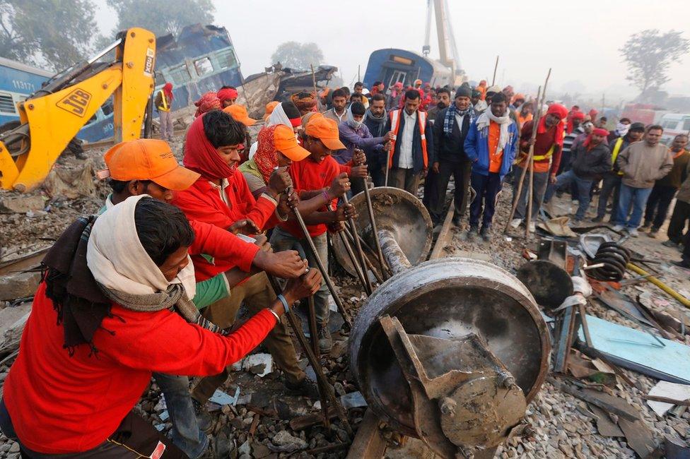 Rescue works continue at the site of an accident where coaches of an Indore-Patna Express train derailed off the tracks, near Pukhrayan area, in Kanpur, India, 21 November 2016.