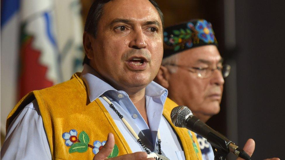 Assembly of First Nations, National Chief Perry Bellegarde, talks to media as Metis National Council President Clement Chartier listens, after the opening of the First Ministers Meeting in Vancouver on March 2, 2016