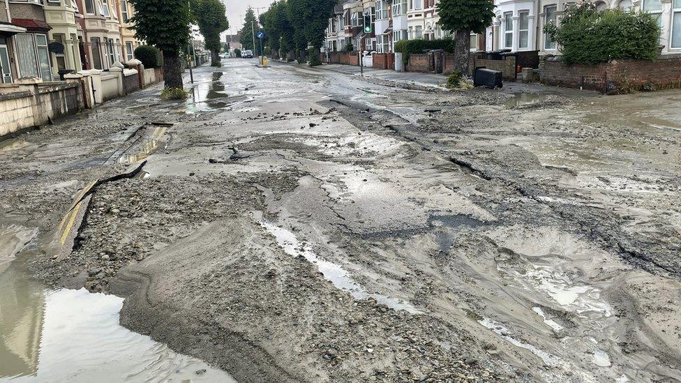 County Road covered in flood debris