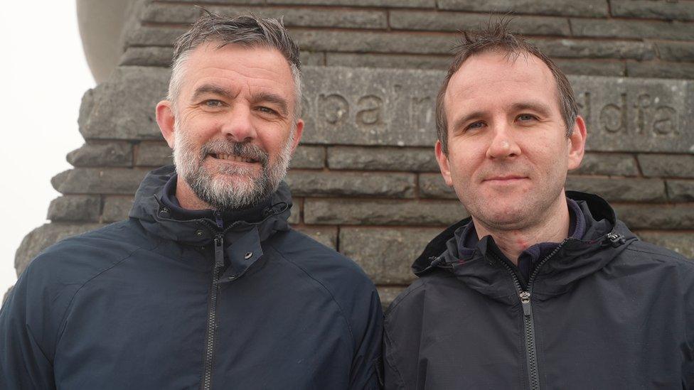 Walkers Scott Fenton and Ian Robertson outside the visitor building on Yr Wyddfa's summit