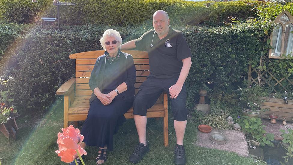 Alan Wright and his mother Elsie Wright enjoying nature in the garden