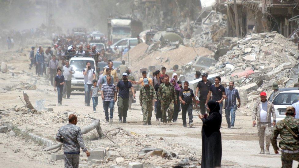 Syrian residents return to the recently-seized Yarmouk Camp enclave to check on their houses and properties in south Damascus, Syria, 24 May 2018