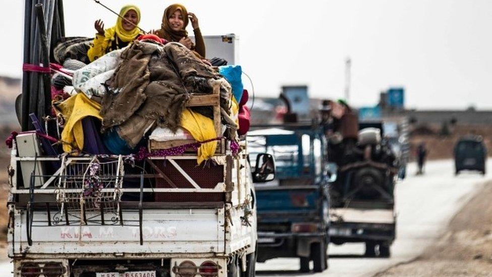 Families flee the border area near the town of Darbasiyah