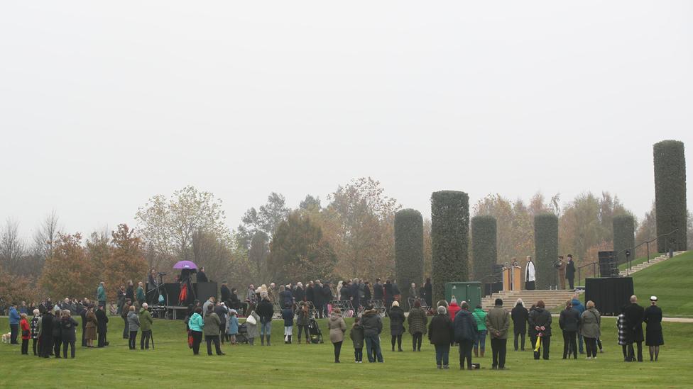 People gather for the service