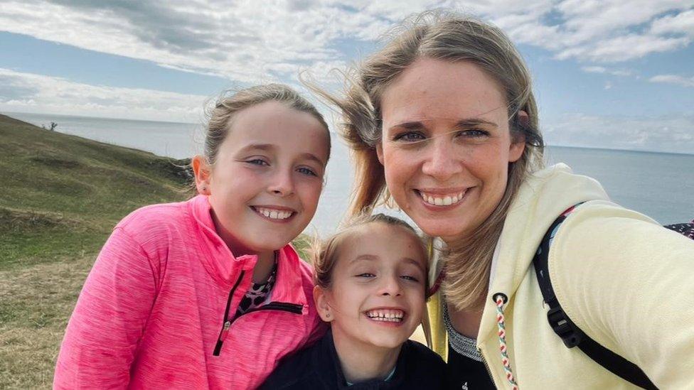 Emily Roberts and her daughters