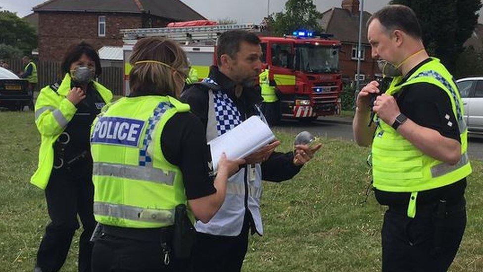 Police officers were given masks to protect them from the smoke