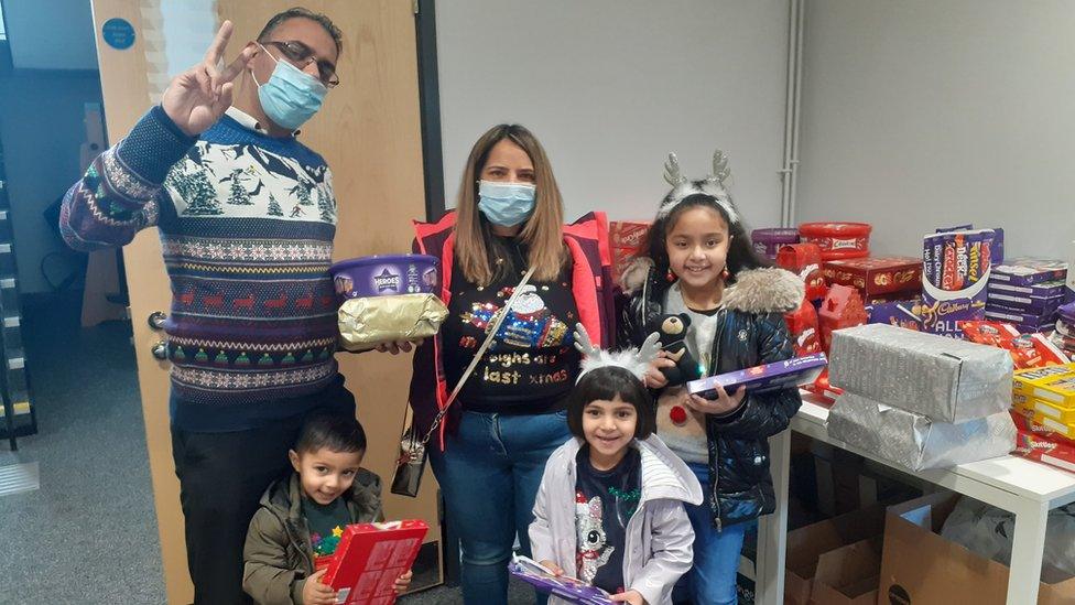 Family with donations they have been given