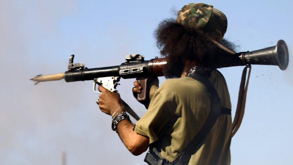 A member of the Libyan National Army (LNA), also known as the forces loyal to Marshal Khalifa Haftar, fires a rocket-propelled grenade during fighting against jihadists in Benghazi's Al-Hout market area on May 20, 2017.