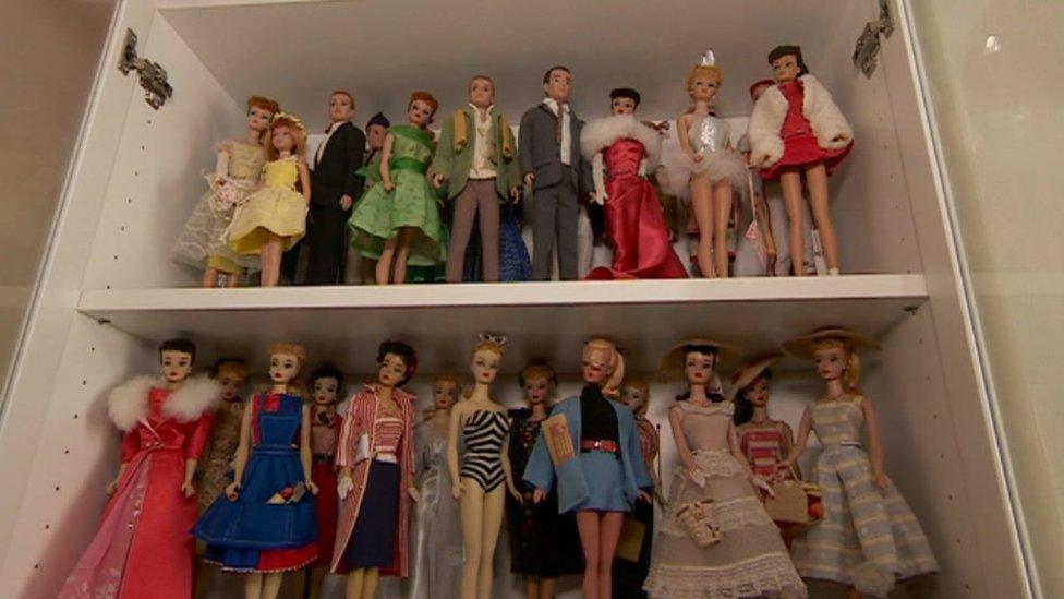 Barbies on two shelves